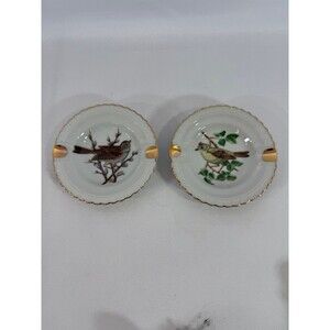Set of 2 vintage porcelain ashtrays featuring bird motifs and gold trim 3.5”